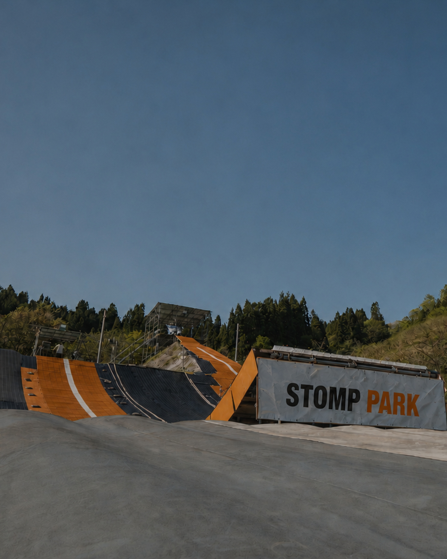 Snowboarder riding down the dryslope line at STOMP Park